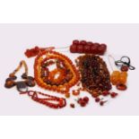 A large collection of "amber" bead necklaces and beads, Including "cherry amber", reconstituted, and