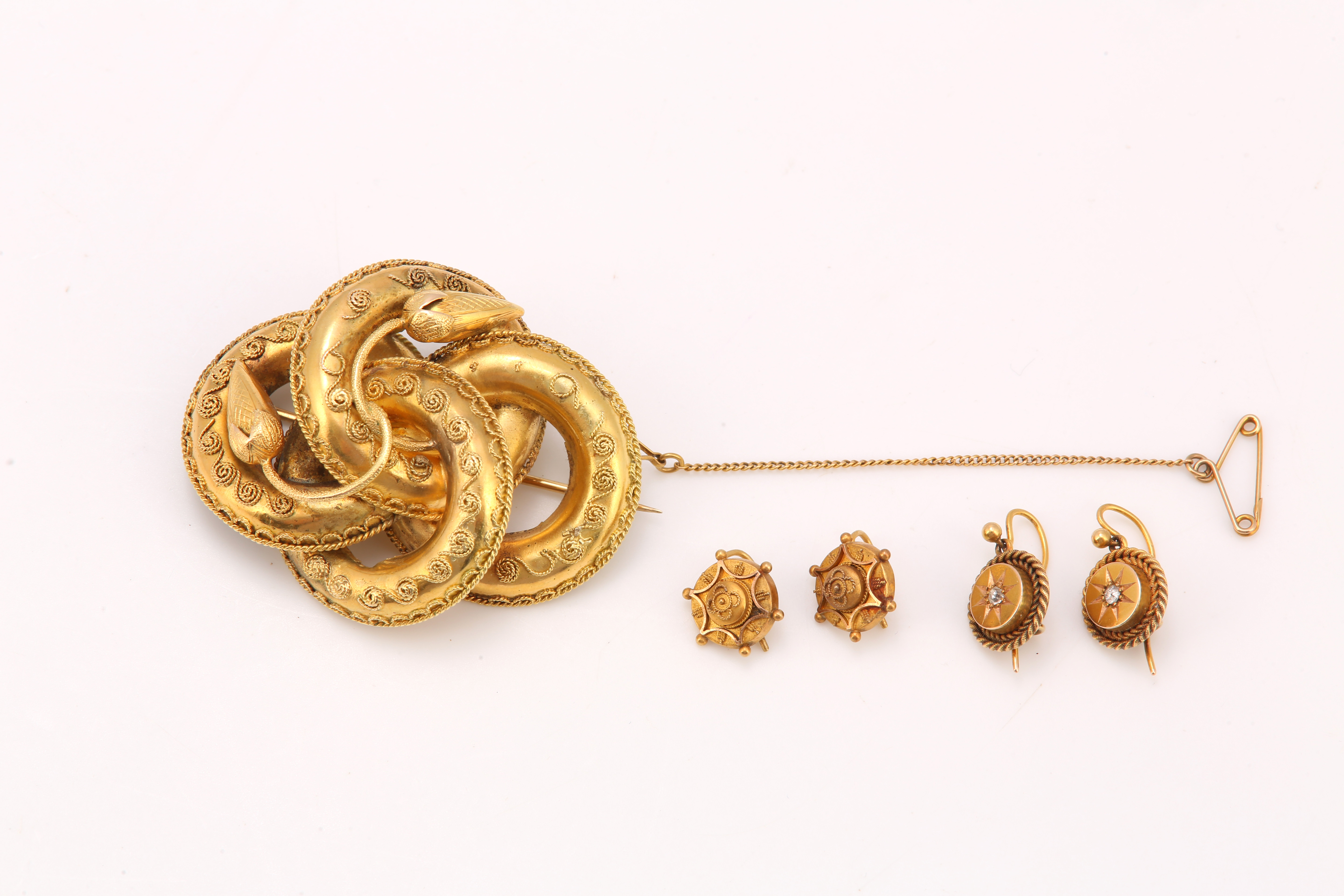 A late 19th century brooch and two pairs of earrings with ropetwist decoration, one pair of earrings