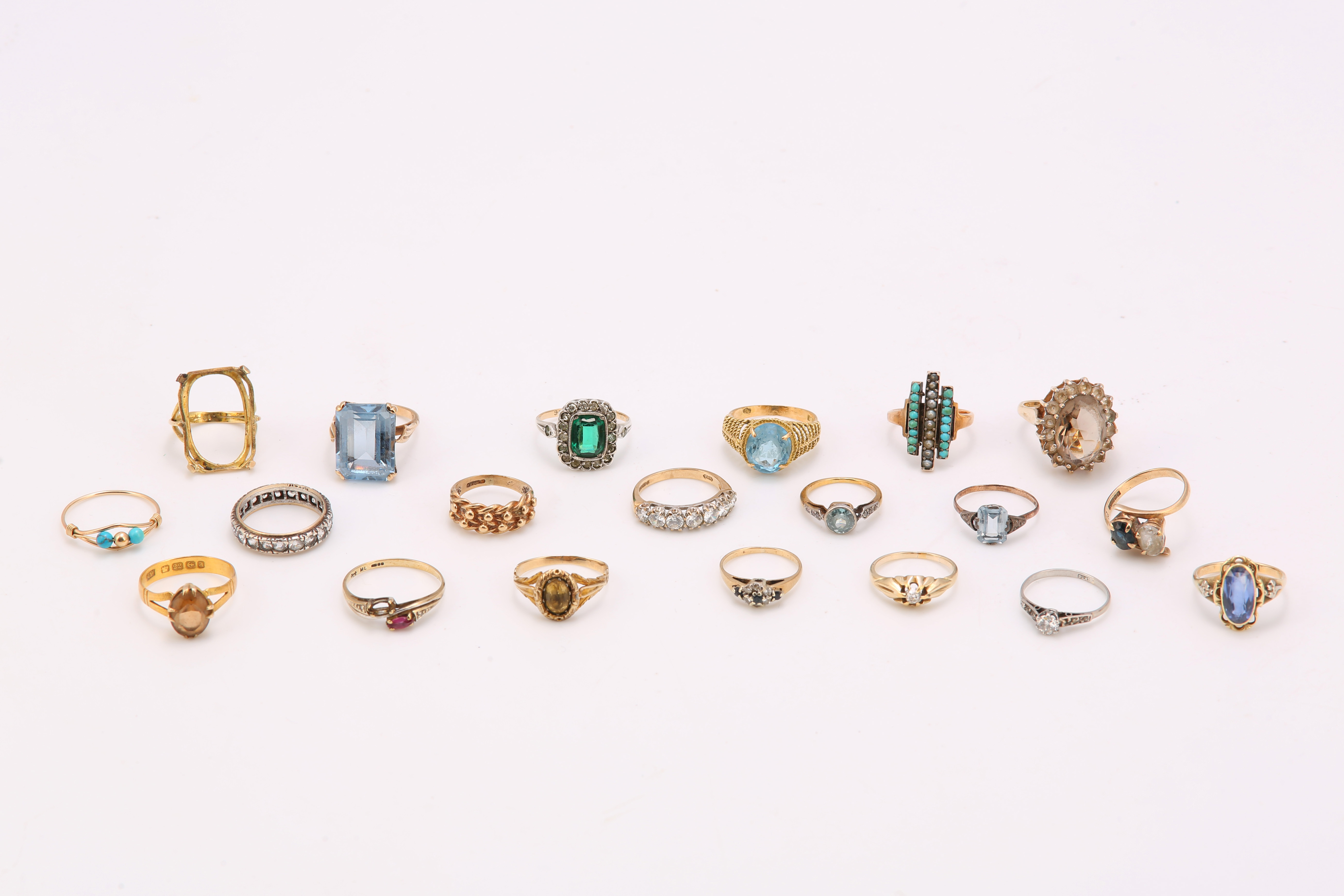 A large group of rings including some set with diamonds, some with sapphires, some paste and