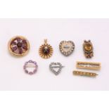 A collection of paste and gem-set brooches, Including a 19th century garnet cluster brooch, with