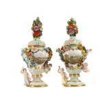 A FINE PAIR OF MEISSEN TOPOGRAPHICAL FLOWER-ENCRUSTED FIGURAL VASES AND COVERS, mid-late 19th