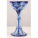 A WILLIAM MOORCROFT FLORIAN WARE CHALICE, circa 1900, the double-ogee bowl raised on a tall stem