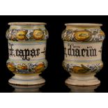 A PAIR OF SMALL ITALIAN MAIOLICA DRUG JARS, 19th century, possibly Deruta, polychrome painted with