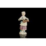 A MEISSEN DOT PERIOD FIGURE OF A HURDY-GURDY PLAYER, circa 1770, modelled standing with the