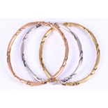 A set of three 9 carat white, rose and yellow gold bangles, UK hallmark (3)