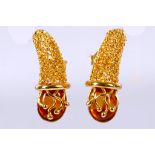 A pair of earrings, Each designed as a cornucopia with an oval amber terminal, amber untested