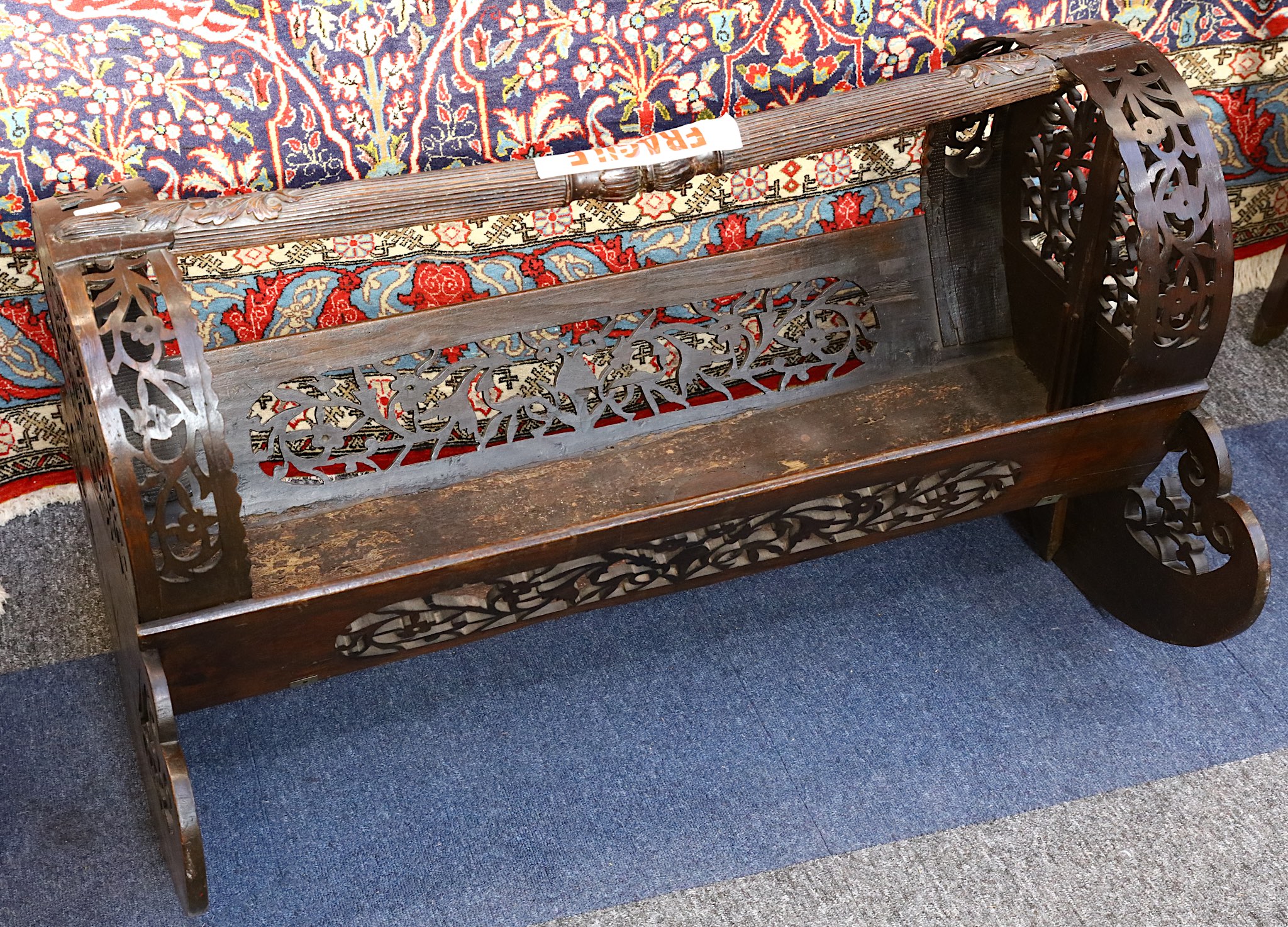 An 18th Century, pierced and carved rocking cradle with marquetry inlaid end panels (possibly