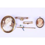 A collection of brooches, including two cameos and three bar brooches, including one set with a