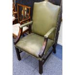 A Georgian style green leather upholstered armchair.