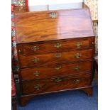 A small Georgian mahogany bureau, with fall front concealing fitted interior, 69.5cm wide.