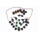 A collection of beetle jewellery, Including a ring, a necklace, two brooches, three pairs of