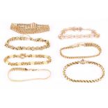 A collection of seven 9ct gold fancy-link bracelets, UK hallmarks (7)