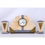 A French Art Deco gilt metal mounted, two colour marble clock garniture, the 8 day movement with