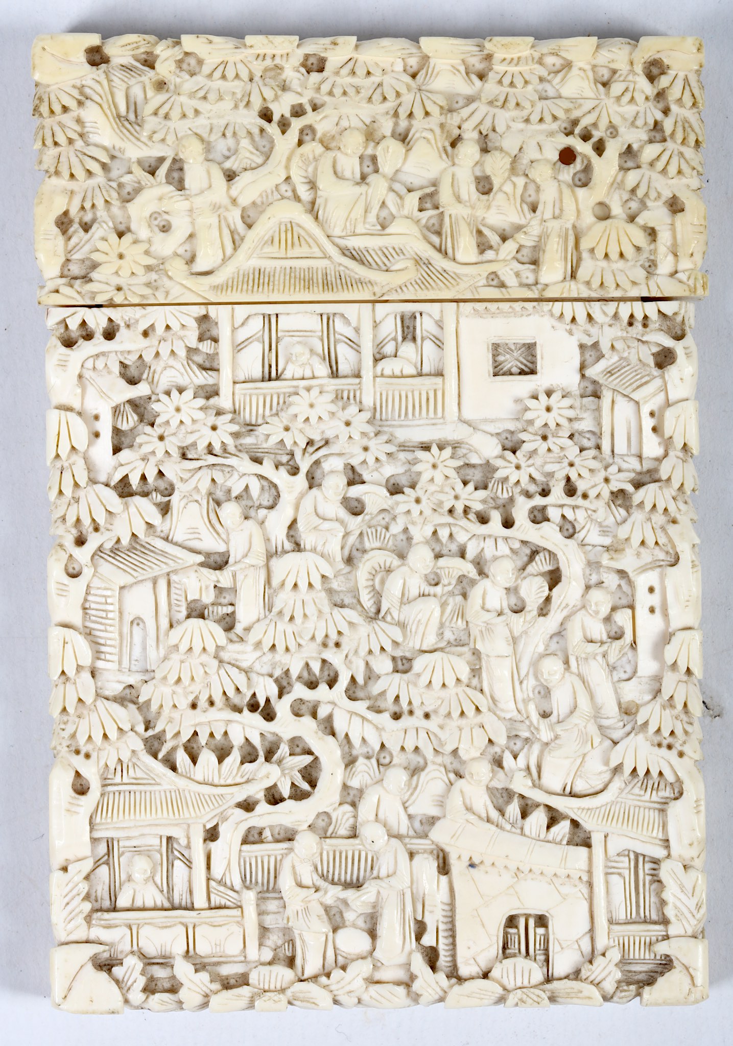 A Chinese 19th Century, Cantonese ivory card case intricately decorated with scenes of village