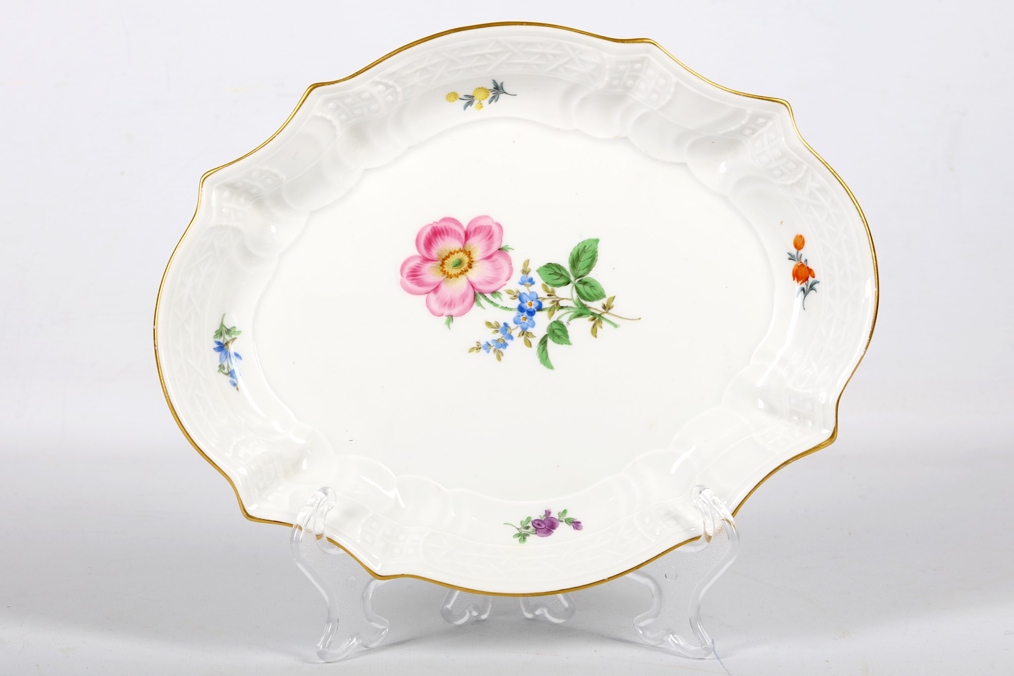 A 20th Century Meissen shaped porcelain dish, painted with flora sprays.