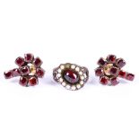 A pair of garnet earrings and a garnet and pearl cluster ring, one pearl deficient (2)