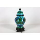 Italian Bellini pottery Chinese influence baluster vase and cover, floral design on a turquoise