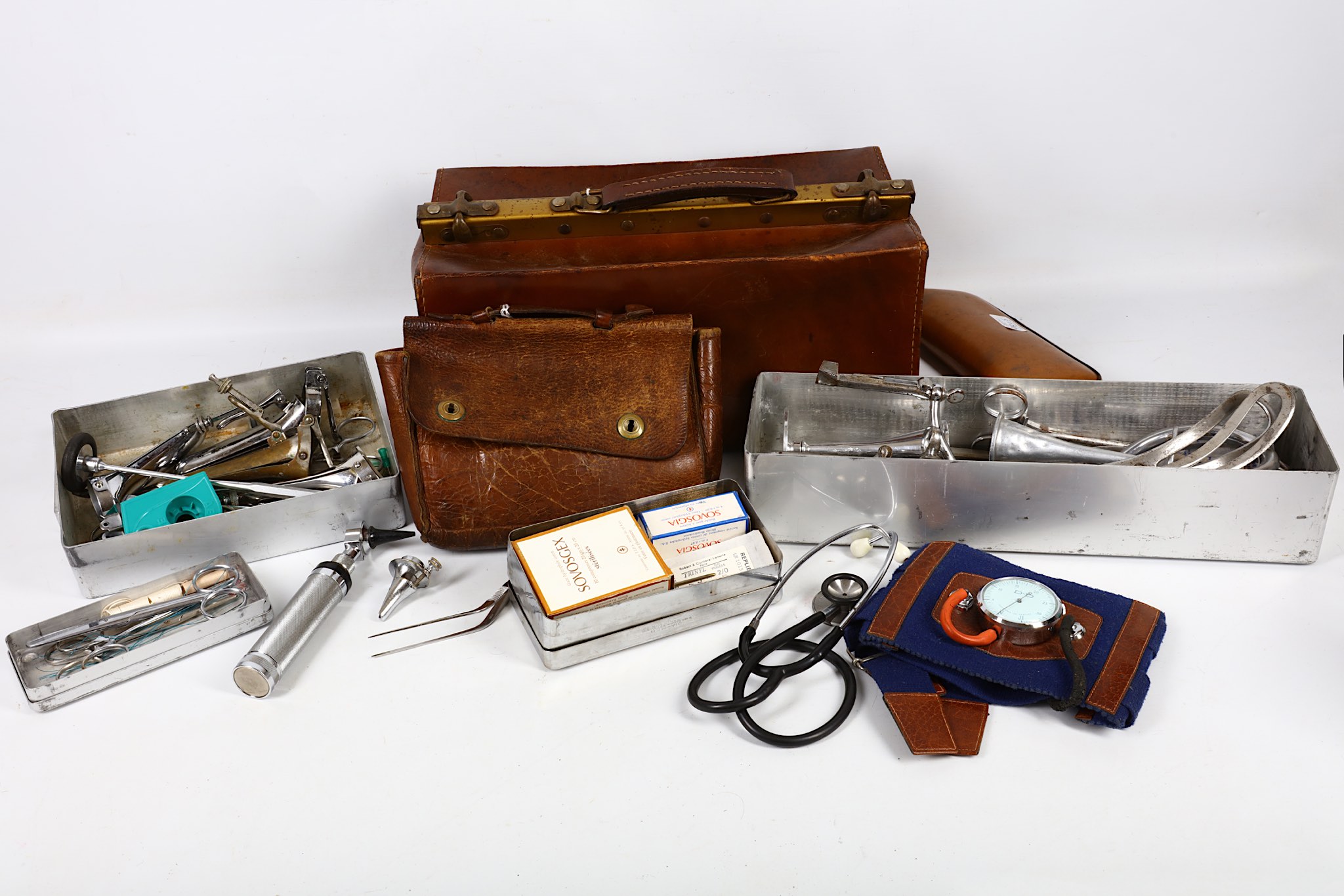 A collection of metal cased medical tools and equipment, including some in leather pouches, sold