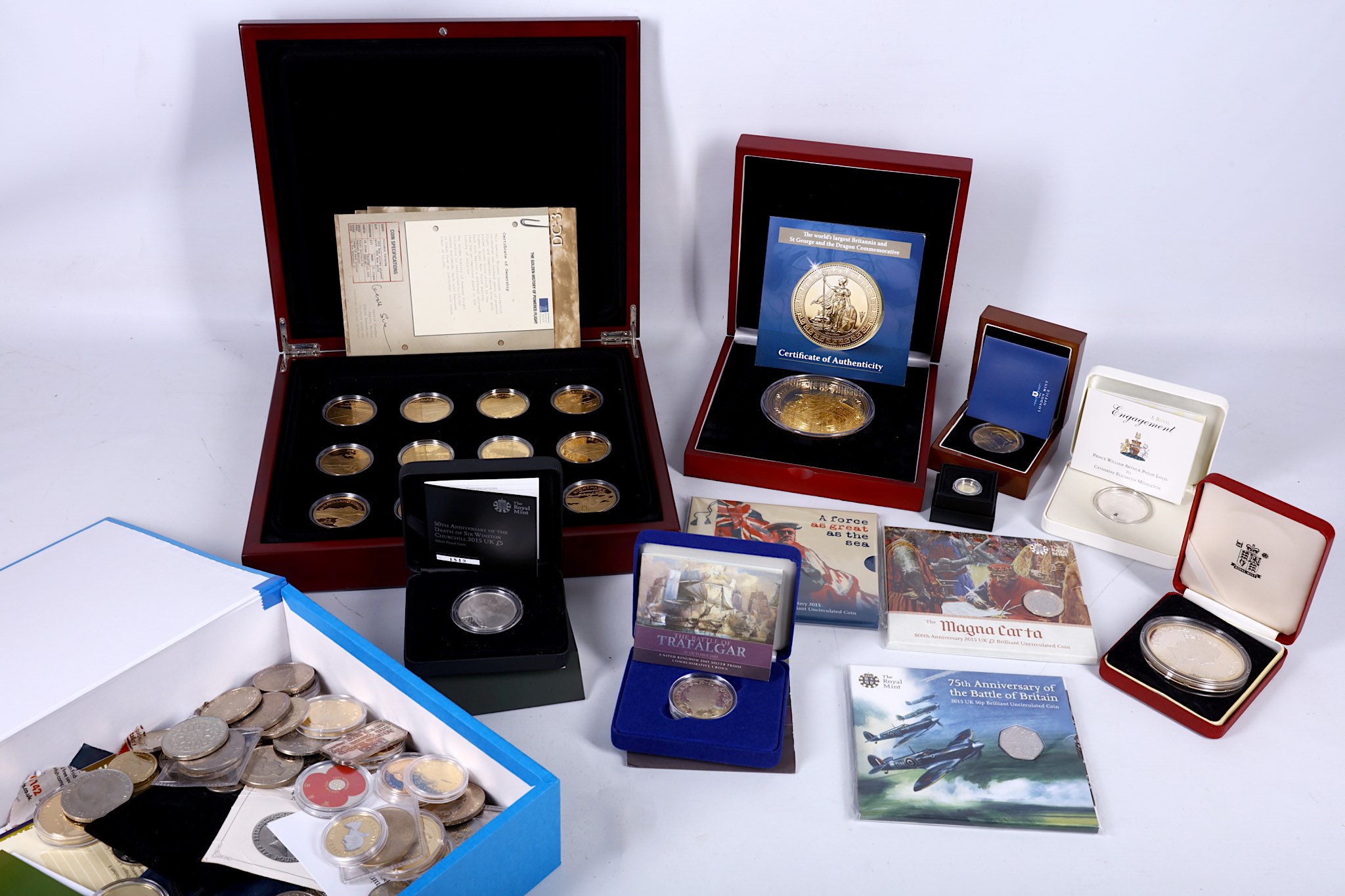 A mahogany cased set of 12 999 fine silver plated coins, with 999 fine gold coins to commemorate