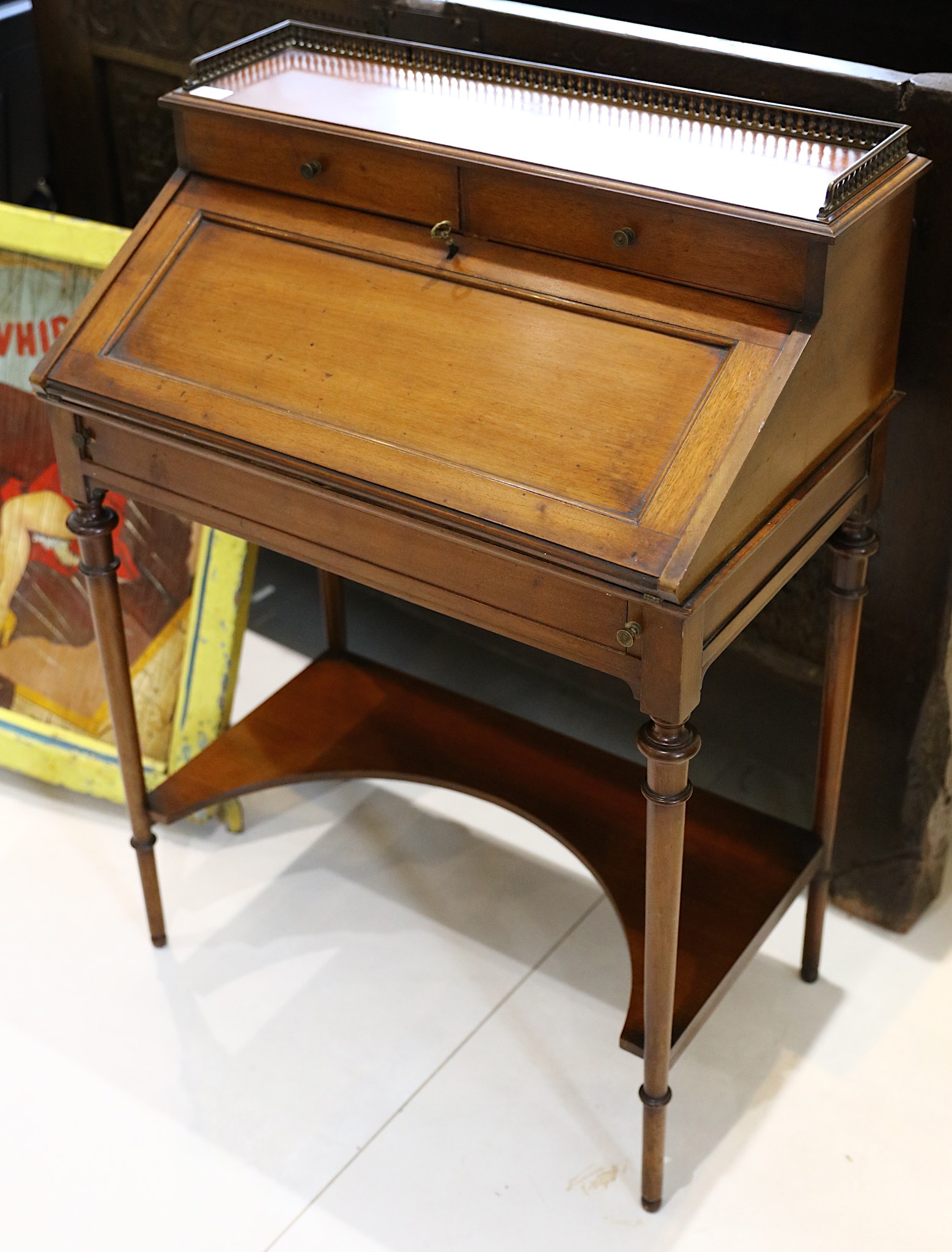 Late 19th century French mahogany Bonheur Du Jour, with 3/4 brass gallery over two drawers and