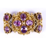 An amethyst brooch, circa 1840, Converted from a clasp, set with oval-cut amethysts in foiled