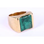 A gold and malachite ring, mounted in 18 carat gold, malachite cracked