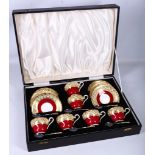 A black leather cased set of six Aynsley bone china tea cups and saucers, together with six matching