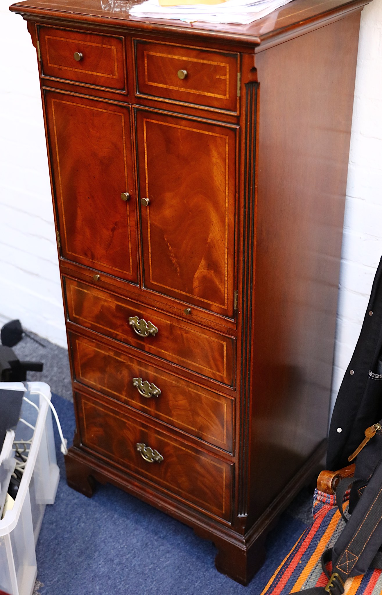 A reproduction mahogany tallboy in Georgian style, together with a reproduction serpentine front