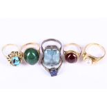 A collection of rings, Including a nephrite ring, an imitation sapphire and imitation diamond