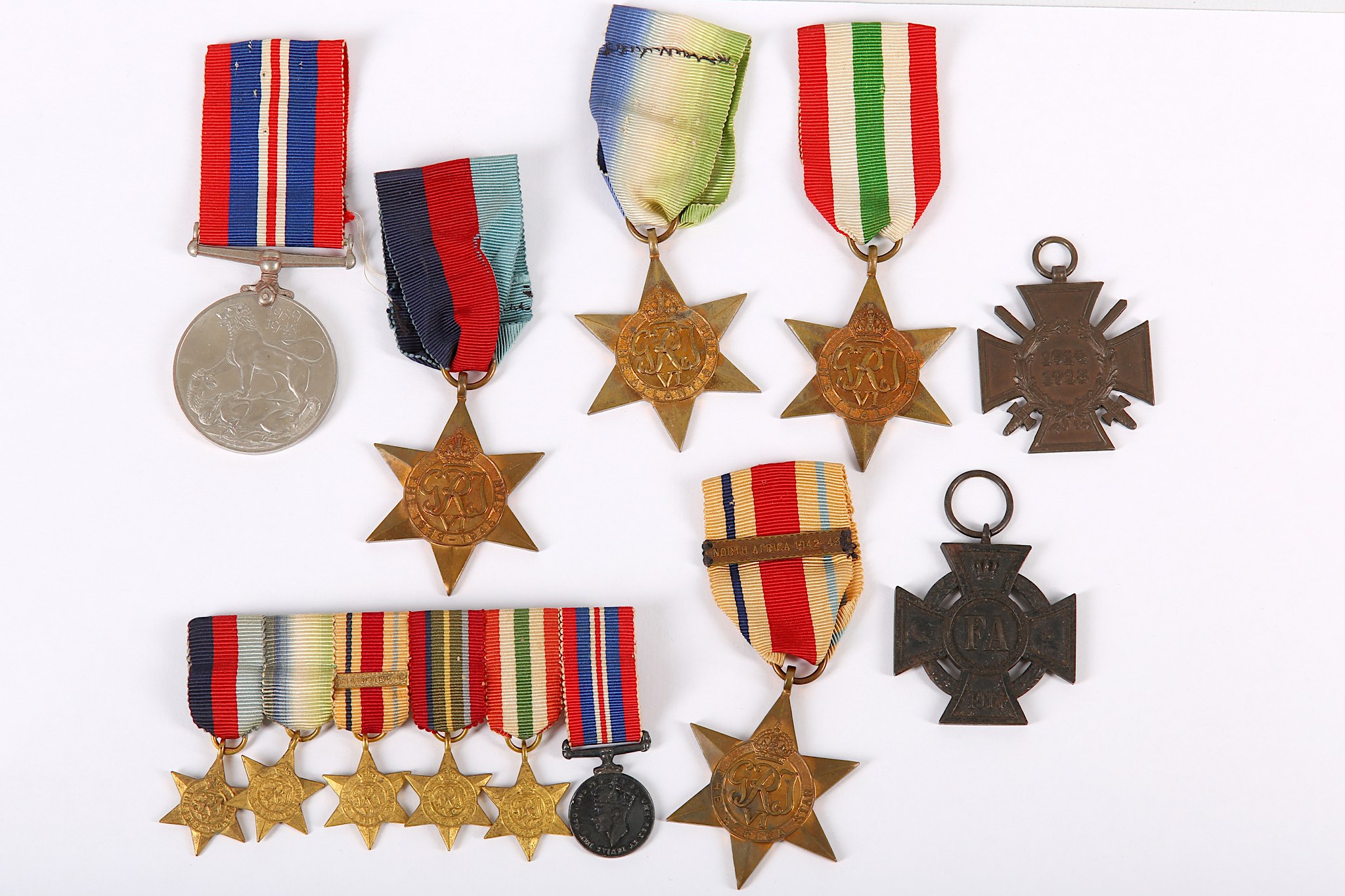 A medal group awarded to Thomas A.E. Bowler, to include miniatures, a 1939-1945 Star (ribbon), The