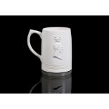 KEITH MURRAY FOR WEDGEWOOD, a rare Art Deco ivory glazed pottery mug, to commemorate the