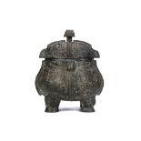 A CHINESE BRONZE OWL RITUAL VESSEL, XIAO YOU. Ming Dynasty, or later. Cast in the form of two