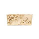 A CHINESE 'EROTIC' IVORY WRIST REST. Qing Dynasty, 19th Century. The exterior naturalistically