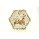 A CHINESE HEXAGONAL FOLIATE RIM DISH. Qing Dynasty, Yongzheng era. Decorated with a lady looking