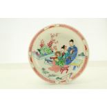 A CHINESE FAMILLE ROSE ‘LOVERS’ TEACUP AND SAUCER. Qing Dynasty, Yongzheng era. Brightly enamelled