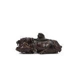 A CHINESE ‘BUDDHIST LION DOG AND PUP’ BRONZE CENSER AND COVER. 17th Century. Modelled as a recumbent