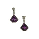 A pair of amethyst and diamond earrings