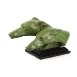 M. Bertin, a green patinated bronze of greyhound heads, supported on a black base.