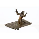 A Bergman orientalist cold painted bronze of an Arab at prayer on carpet, 18.5cm long x 9cm high.