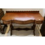 A Victorian mahogany serpentine front side table with single drawer, supported on 2 turned supports,