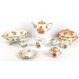 Eight pieces of Herend porcelain comprising Queen Victoria Fortuna Rust teapot, chocolate cup and