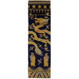 A NINGXIA PILLAR LONG RUG, CHINA approx: 14ft.9in. x 3ft.10in.(449cm. x 117cm.) The indigo field