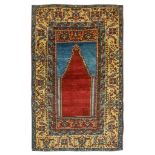 AN ANTIQUE ANATOLIAN PRAYER RUG, TURKEY approx: 7ft.3in. x 4ft.6in.(221cm. x 137cm.) The sea-blue