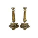 A 19th Century French Empire style, pair of gilded metal sideboard candlesticks, 23.5cm high, one