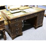 A reproduction mahogany double pedestal desk, in Georgian style, with green leather inset top, 90