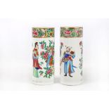 A pair of Chinese 19th Century Cantonese cylindrical spill vases, both decorated with courting noble