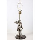 Mid 20th century silver plated table lamp modeled as a Cavalier sheathing his sword on circular