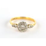 A diamond cluster ring, Set with a cluster of brilliant-cut diamonds, between similarly-set