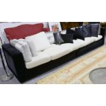 A modern contemporary black velvet sofa, from a show house in the 1 Hyde Park development,