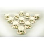 Twelve Coalport strawberry pattern tea cups and eleven saucers.